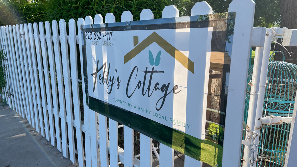 Kelly's Cottage Tolleson AZ sign with phone number