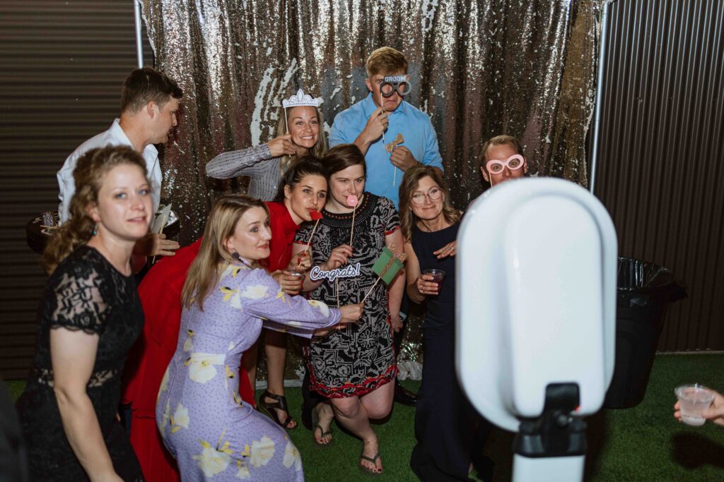 photo booth couple on dance floor the willow wedding venue surprise - Lexi Wyatt photo graphs